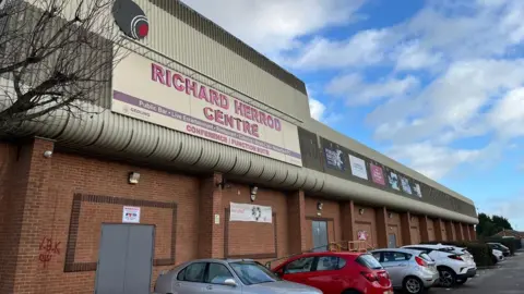 A modern municipal building with the words 'Richard Herrod Centre' on the front 