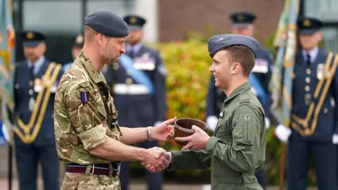 Reuters Prince William awarding a flying instructor