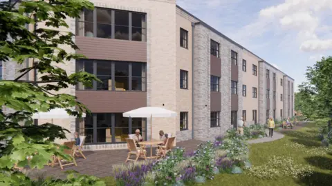 An artist's impression of the proposed care home which is a large brick building with large windows. There are brown wooden panels under the windows. There are two outdoor tables in front of the building to the left with white parasols. There are benches down the side of the building with people walking. To the right there is grass, trees and plants.