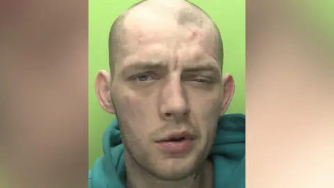 A custody image of Reece Wheat