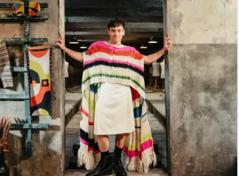 Jamie Simpson / Channel 4 Tom Daley hosts the new Channel 4 show. He is pictured with a colourful knitted top