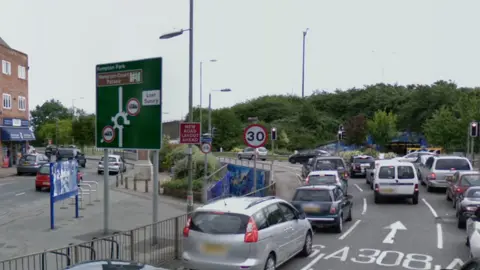 Traffic queuing on Staines Road West, waiting to join the roundabout leading to the M3.