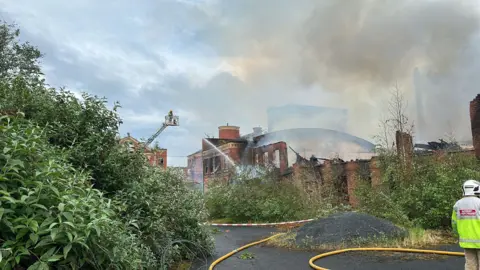 Robbie Butler The fire at Hilden Mill being put out 