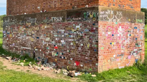 Network Rail The brickwork of Twemlow Viaduct daubed in brightly coloured graffiti  