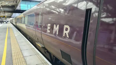 An East Midlands Railway train at a platform