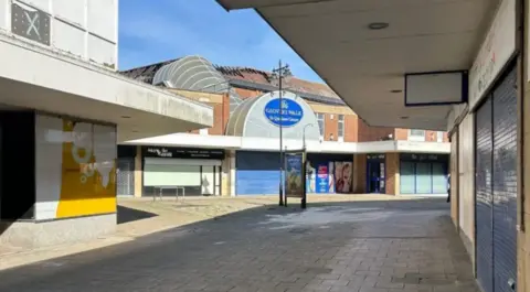 Somerset Council Image of an empty pedestrianised high street outside Glovers Walk shopping centre