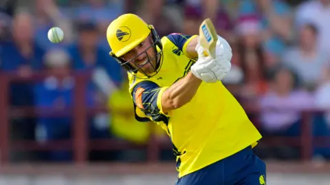 Joe Weatherley, in action for Hampshire, hitting a shot into the off-side.