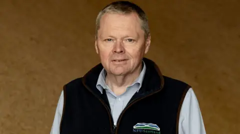 NFU Scotland A man with short grey/blond hair in an NFU Scotland zip-up top with a shirt underneath