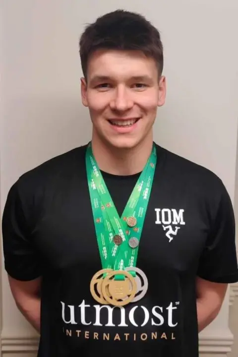 LEE HOLLAND Pete Allen wearing three medals