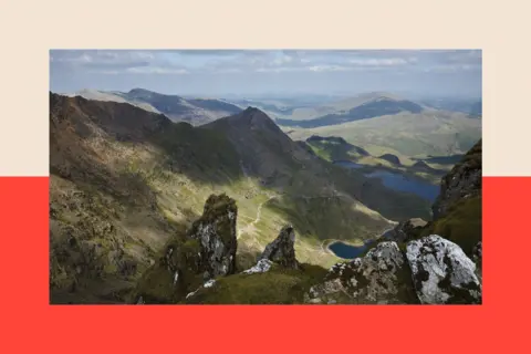 Universal Images Group via Getty Images View to Crib Goch and the Pyg Track with Llyn Glaslyn and Llyn Llydaw from Snowdon summit, Gwynedd, Wales, United Kingdom
