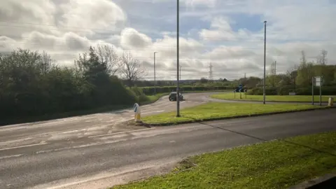 An A-road leading into a roundabout