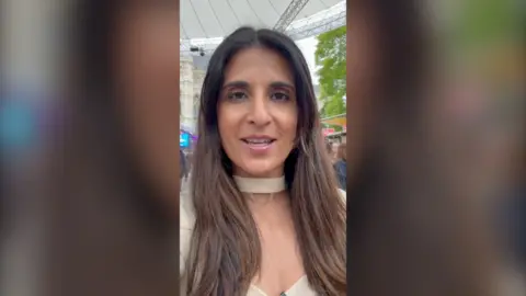 Nomia Iqbal looks at the camera and smiles. 