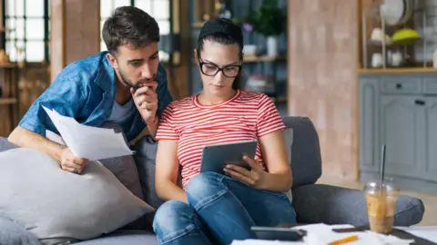 Getty Images Couple looking at tablet computer