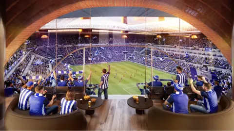 BCFC Fans wearing blue and white, celebrating in a football box overlooking the field.