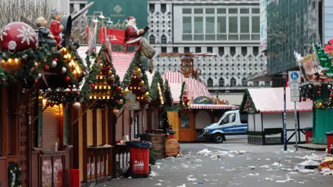 Reuters A police vehicle stationed at the scene of a vehicle-ramming attack on the Christmas market in Madgeburg