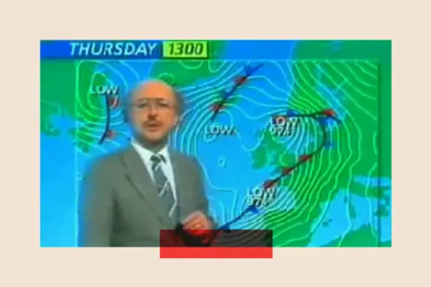 Fuzzy image of weatherman Michael Fish standing in front of the forecast