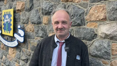 BBC Neil Inder smiling at the camera