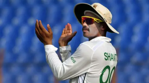 Bangladesh's Najmul Hossain Shanto encourages his side in the field