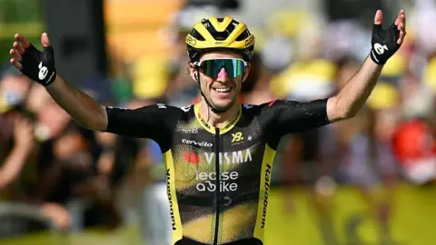 Simon Yates celebrates