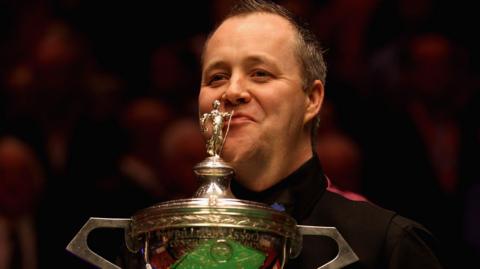 John Higgins with the World Snooker Championship trophy in 2011
