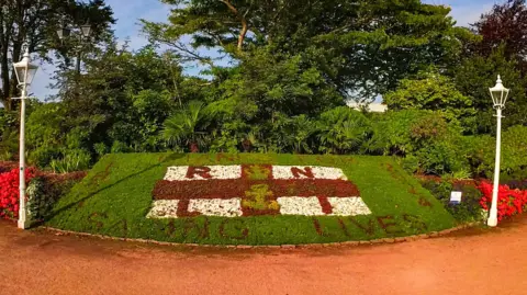 RNLI/Madalin Spataru A flowerbed with a tribute to the RNLI to mark the charity's 200th anniversary in Jersey's Howard Davis Park. The design includes an RNLI flag made from red, white and green flowers and red plants spelling out 'thanks for saving lives' written around the sides.