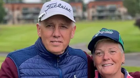 BBC A man and women standing on grass