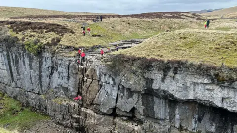 Cave Rescue Organsation People climbing up the rocks