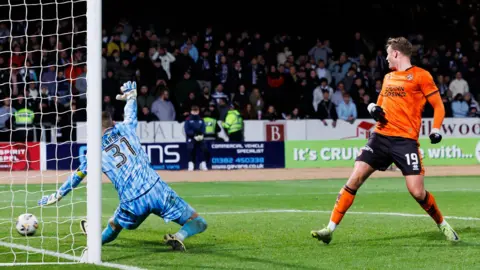 Sam Dalby scores against Dundee at Dens Park