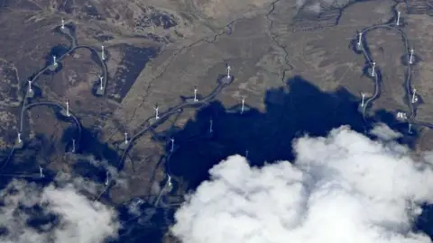 Thomas Nugent A view from above the clouds of wind turbines dotted across the south of Scotland landscape