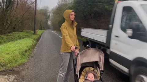 Laura Fenton is walking in Blakes Lane as a van passes on the other side of the road.