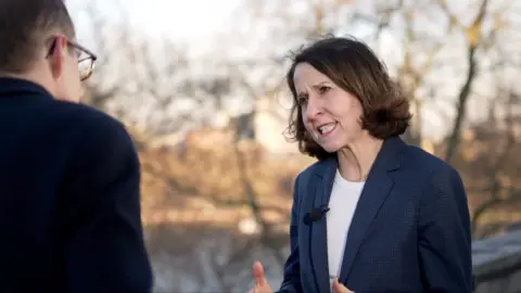 Chris Mason interviewing Liz Kendall outside