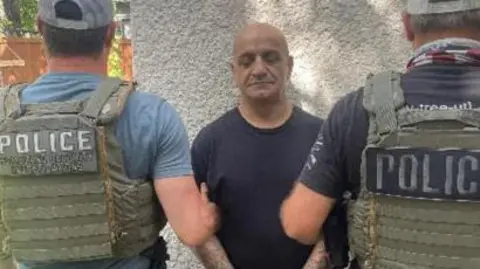 An Iranian with alleged ties to the Revolutionary Guard and Hezbollah was arrested on Sunday by immigration police. Police are seen detaining the man.