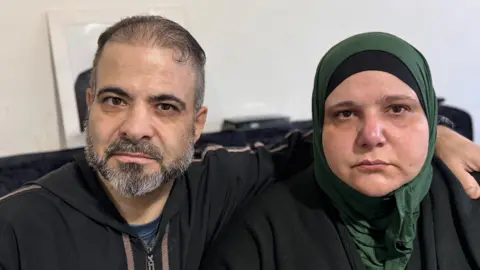 A photo of Noufel and Arwaassi Asmael, who is wearing a headscarf