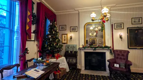 Charles Dickens Museum The lounge at 48 Doughty Street decorated with a Christmas tree as it would have been when Dickens lived there with his family
