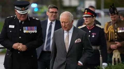 PA Media The King (right) meeting Greater Manchester Police Chief Constable Stephen Watson (left) and Greater Manchester mayor Andy Burnham (back centre)