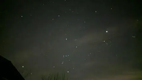 Yen Milne The night sky with several very bright stars shining. The photo was taken during a week when 7 planets were visible in the sky over the south. 