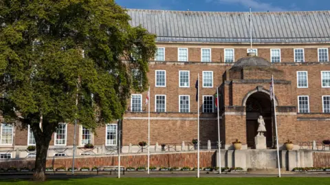 Part of Bristol City Hall pictured from the green lawn on College Green, on a sunny day