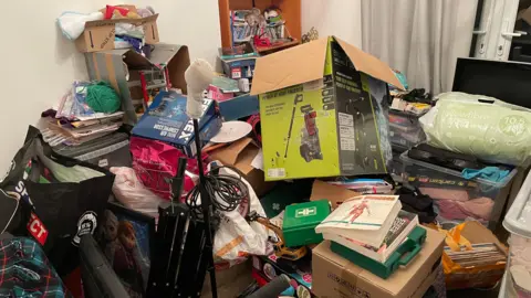 Boxes and other belongings being sorted for their move