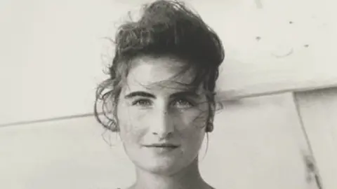 Garda handout A black and white image of Annie McCarrick with her long hair tied up in a bun.