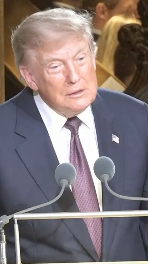 Trump delivers a speech at a lectern
