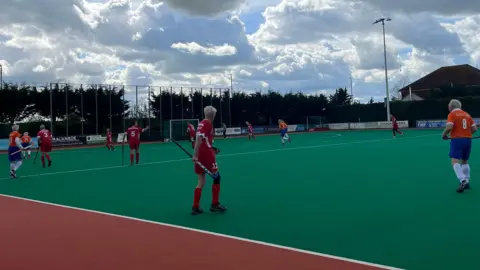 Yetunde Yusuf/BBC England's over 80s hockey team