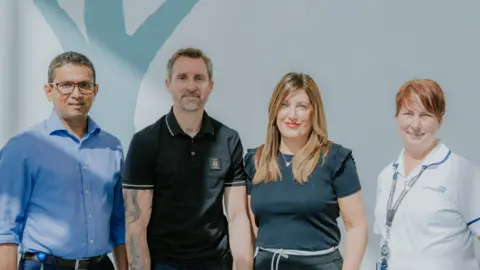 Sherwood Forest Hospitals NHS Foundation Trust Left to right: Dr Nishantha Silva, Damien Gath, Amanda Gath, and Samantha Haynes