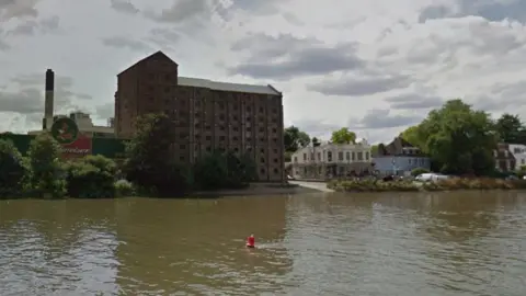 Google A StreetView image showing the old brewery building from the River Thames in Mortlake