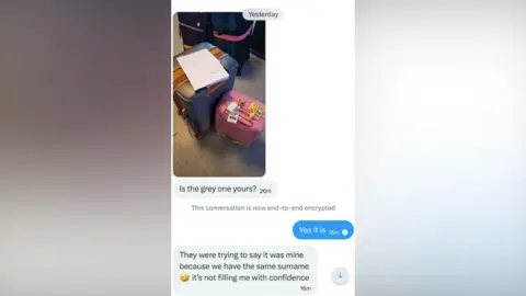 Hayley Chapman A text conversation and image of two suitcases, one grey, one pink. It reads: "Is the grey one yours? Yes it is. They were trying to say it was mine because we have the same surname. It's not filling me with confidence. 