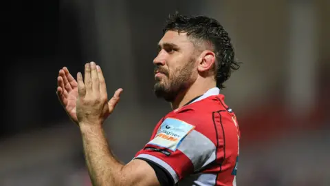 Gloucester rugby player Matias Alemanno applauding at the end of a match