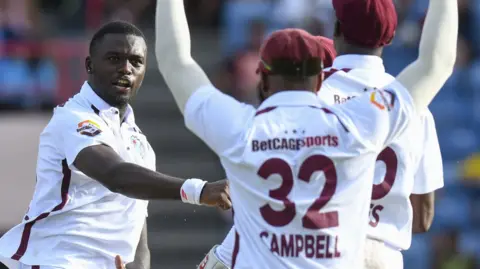 West Indies' Jaylen Seales celebrates taking a wicket against Australia