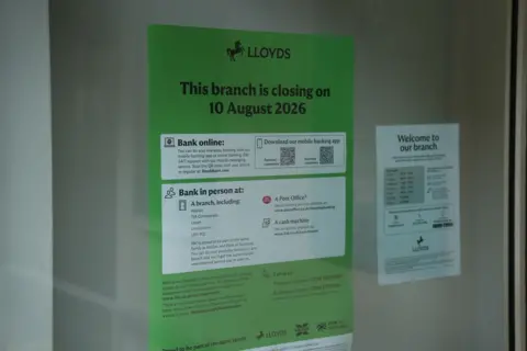 BBC news A green sign in the window of Lloyds bank describes the closure of the Horncastle branch on 10 August 2026.