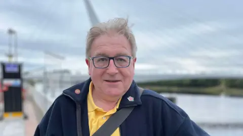 Kevin McCallum from Hyndland standing in front of the Govan-Partick Bridge.