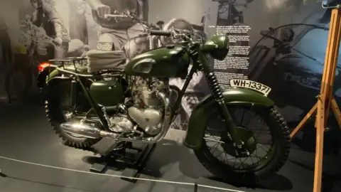IBCC A vintage green motorcycle
