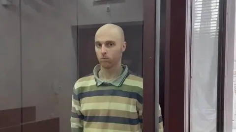 PROSECUTOR'S OFFICE OF THE LUHANSK PEOPLE'S REPUBLIC Oscar Jenkins in a Russian-controlled court in Luhansk in a picture provided by the region's prosecutor's office